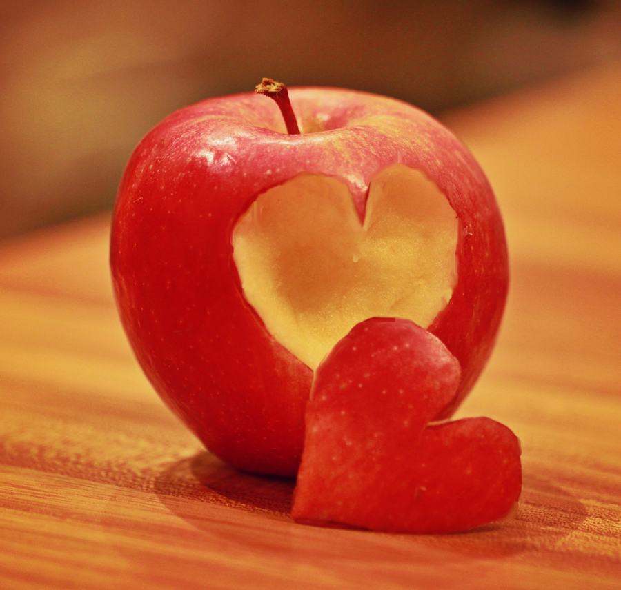apple with a heart shaped piece cut out