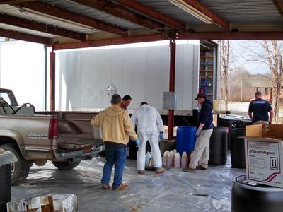 Men collecting pesticides