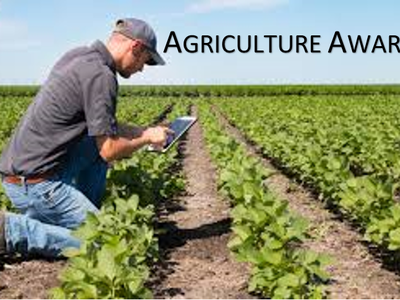 Person kneeling in a crop field using a tablet; text "AGRICULTURE AWARD" at top right
