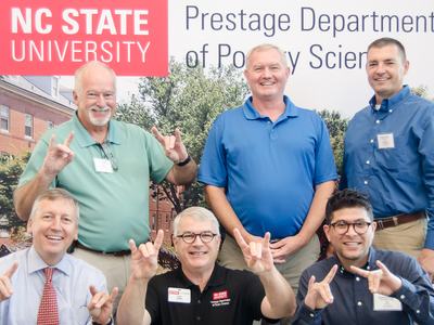 Dean Richard Linton with industry members and Extension faculty