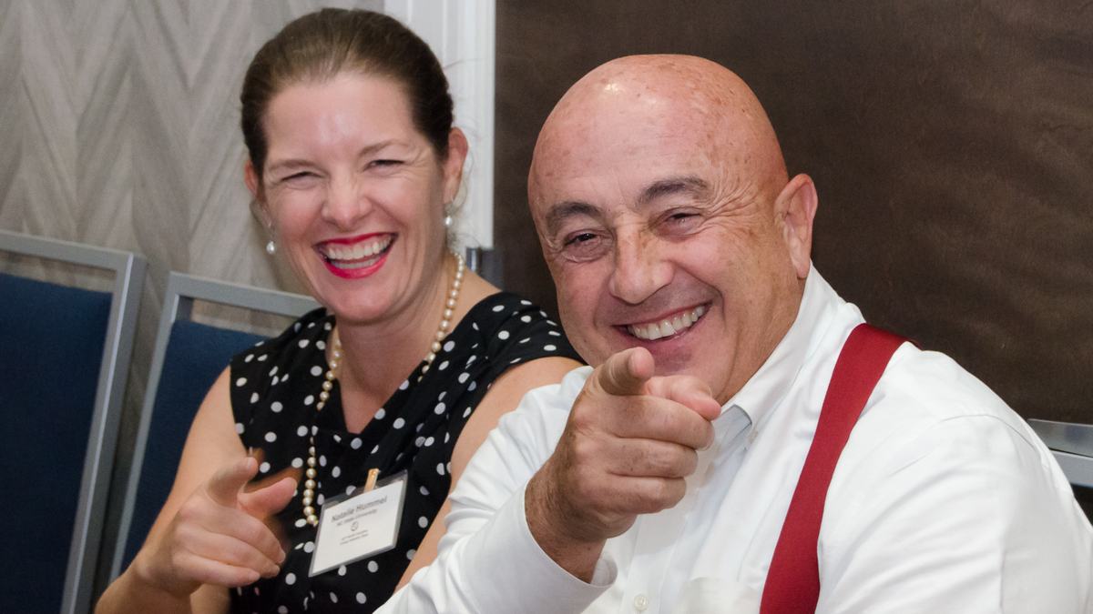 Natalie Hummel and Rich Bonanno pointing at the camera