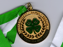 Gold medal with green 4‑H clover; reads "Head • Heart • Hands • Health" and "To Make the Best Better"; green-and-white ribbon