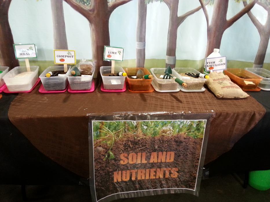 table with boxes of different soil ammendments