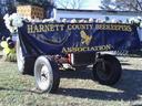 Decorated trailer with banner "HARNETT COUNTY BEEKEEPERS ASSOCIATION" and bee logo