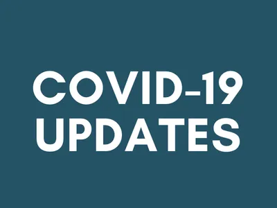 Bold white text "COVID-19 UPDATES" centered on a dark teal background