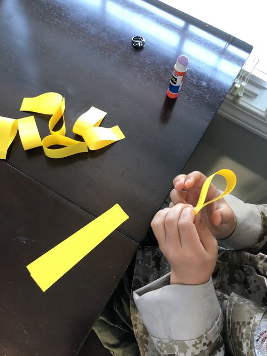 Gluing strips of paper together