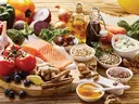 Salmon, grains, nuts, olives, spices, vegetables, vinegar, olive oil