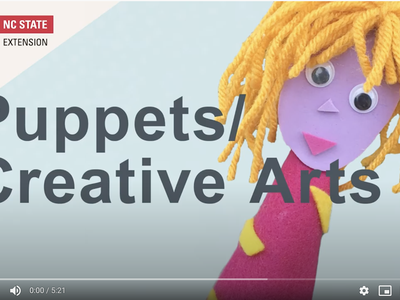 Puppet with yellow yarn hair beside text "Puppets/ Creative Arts" and NC State Extension logo