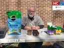 Dr. W. Terry Kelley, PhD at table with Miracle-Gro seed-starting mix and planting supplies