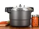 pressure canner and jars of canned vegetables