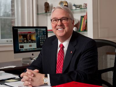 North Carolina State University Chancellor Randy Woodson sitting at a desk in his office.