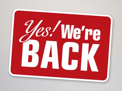 Red rectangular sign reading "Yes! We're BACK" with white border