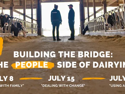 Two men in a dairy barn with the text Building the Bridge: The People Side of Dairying