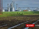 wet fields near grain silo