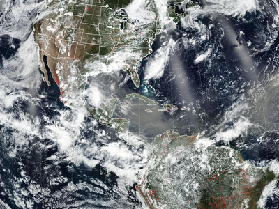 Americas seen from satellite with widespread cloud cover over North, Central, and South America