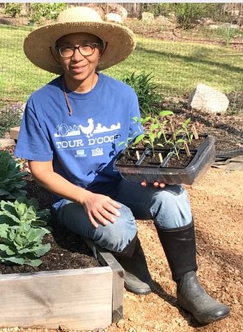 Kim Outing, seadted on raised bed