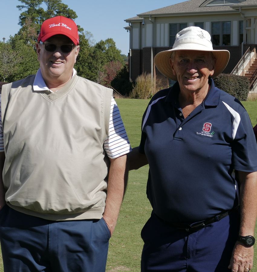 Two men looking at camera
