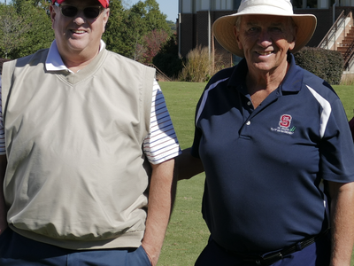 Two men looking at camera
