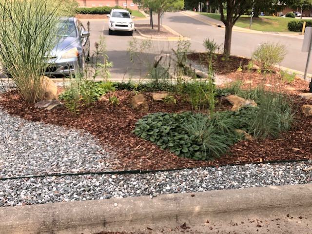 parking lot median bed with gravel path 