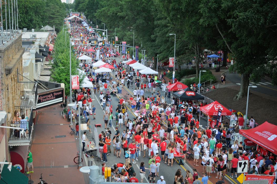 City street full of festival festivities and people.