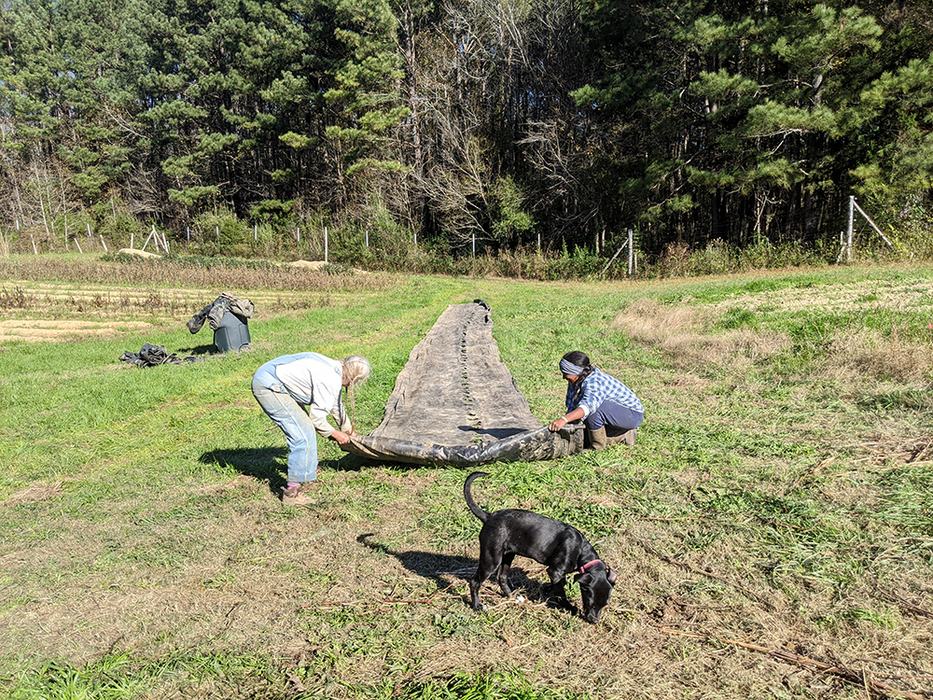 Cathy and Victoria roll up landscape fabric