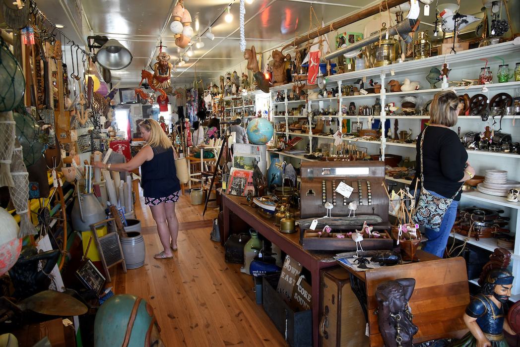 Shoppers peruse an antique store in Swansboro.