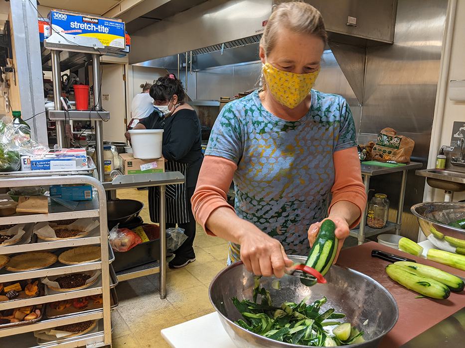Moya Hallstein peels cucumbers