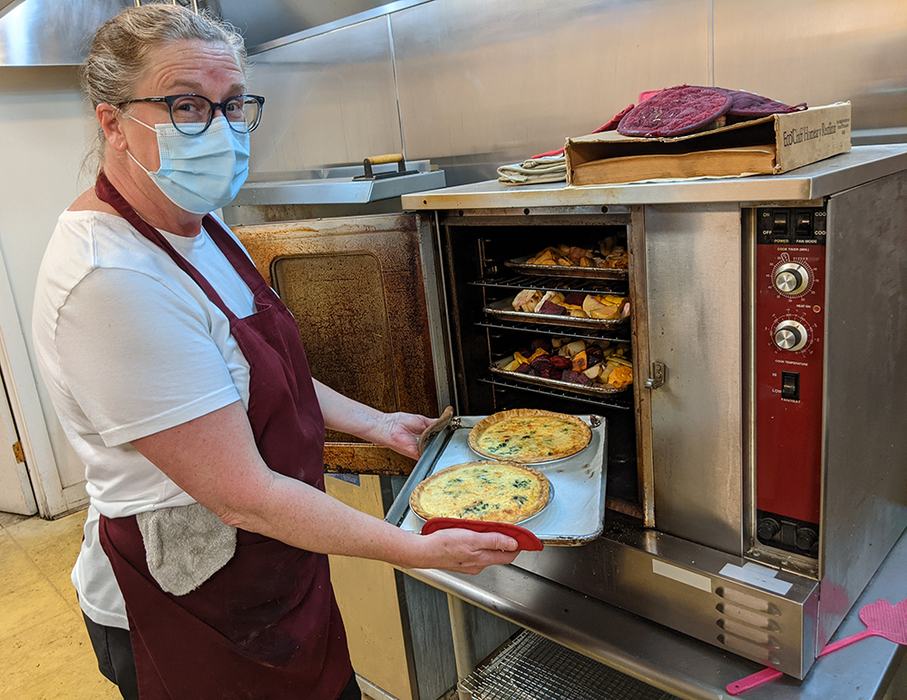 Sarah checks on the quiches