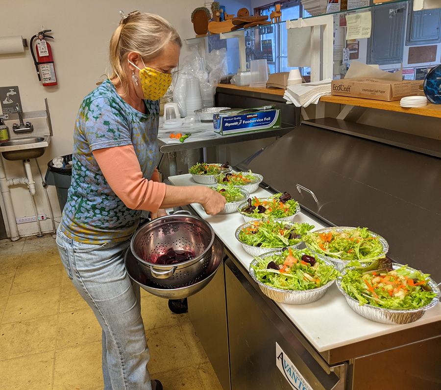 Moya tops the salads with pickled beets