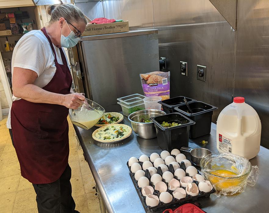 Sarah works on the veggie quiches