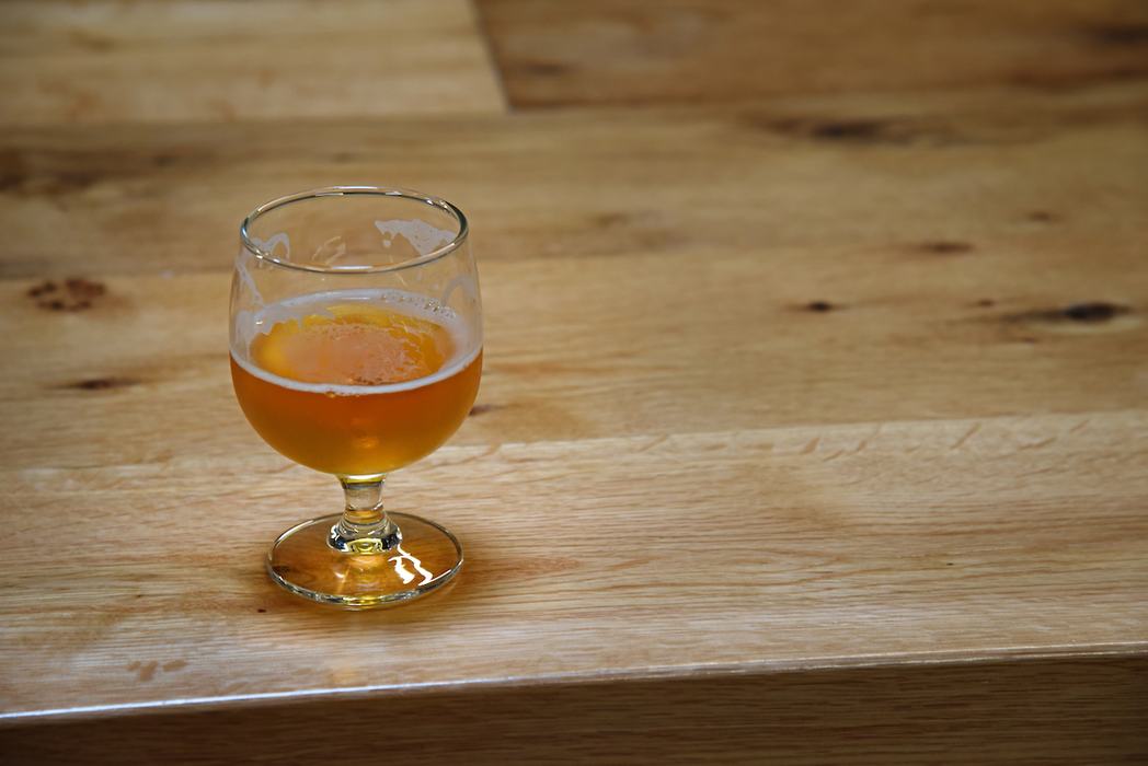 Half full beer glass from New Belgium Brewing