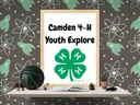 Framed sign reading "Camden 4-H Youth Explore" with green four‑leaf clover logo on a shelf