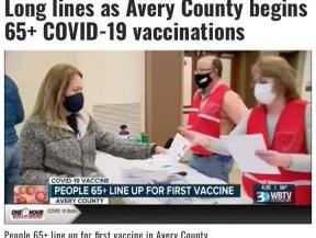 Residents 65+ wearing masks hand forms at a vaccination clinic; visible text: "65+ COVID-19 vaccinations"