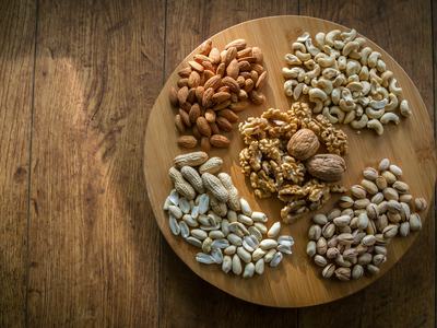 Wooden Serving Board of Various Nuts and Seeds