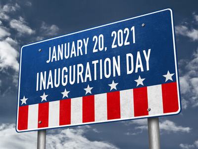 Sign reading "January 20, 2021 Inauguration Day" with stars and red-white stripes