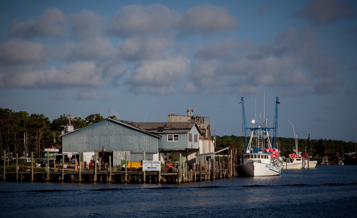Boat waiting at a dock that is on water