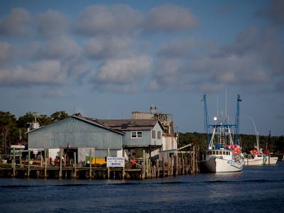 Boat waiting at a dock that is on water