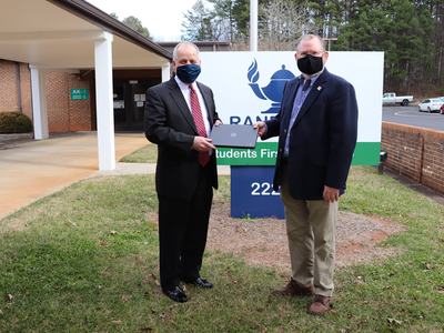 two men holding computers