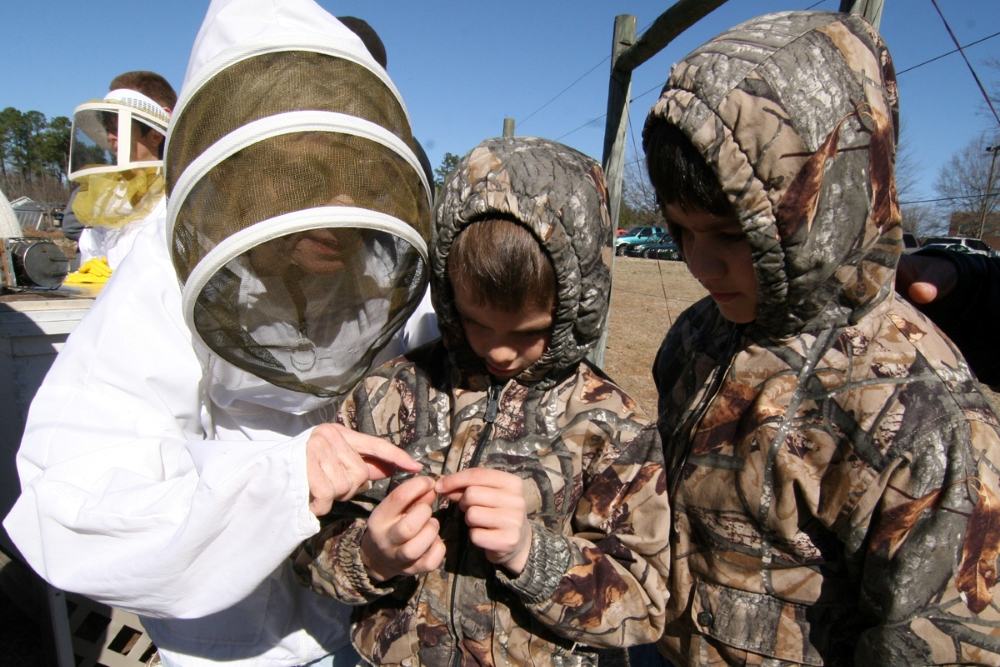 Judy teaches some young beekeepers
