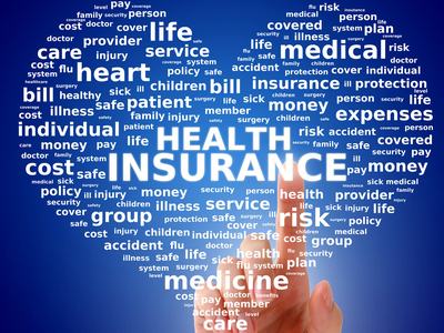 Heart with words “Heath Insurance” in center , related words surrounding