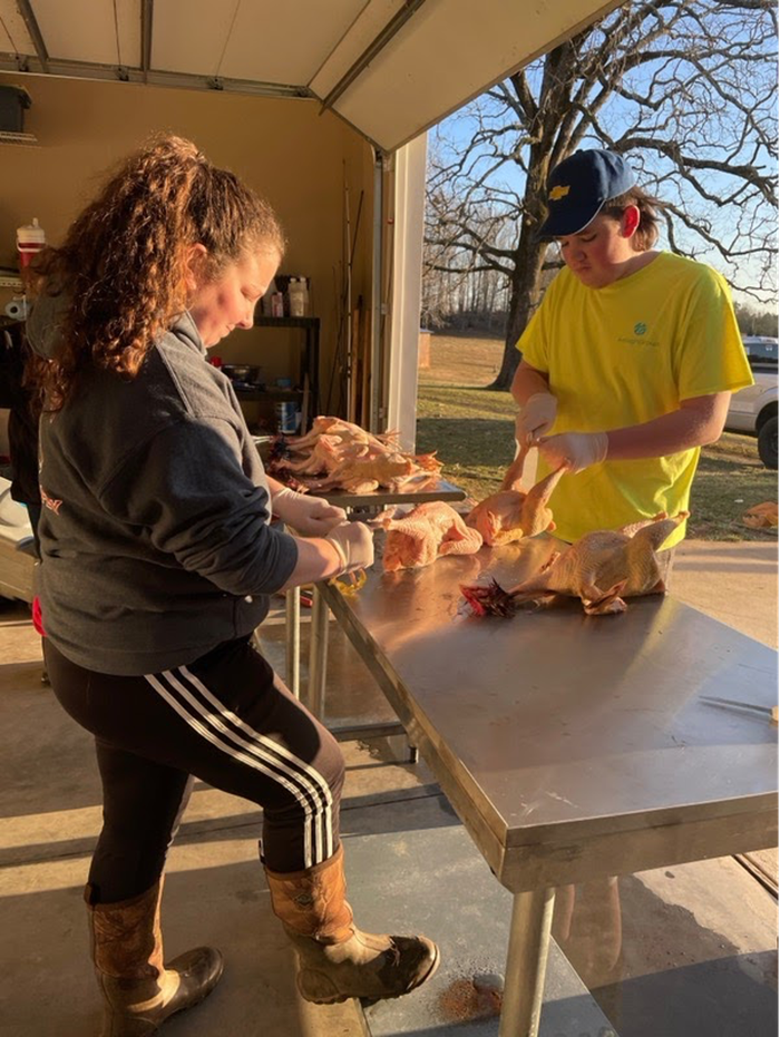 FFA members processing poultry