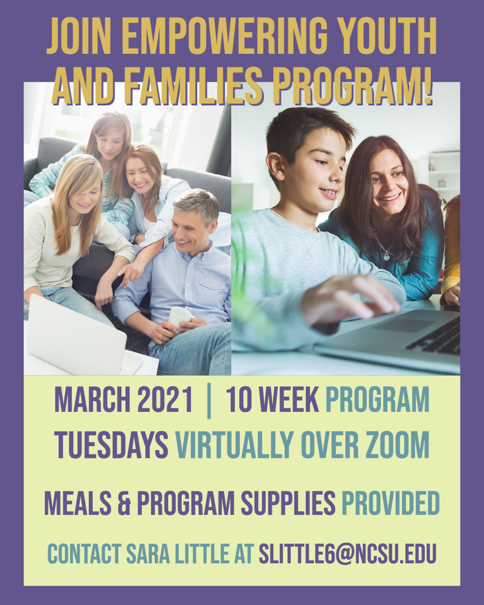 Kids on computers with adults in the background