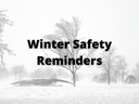 In the background is an image of a ice-damaged tree. In the forefront are the words, "Winter Safety Reminders."