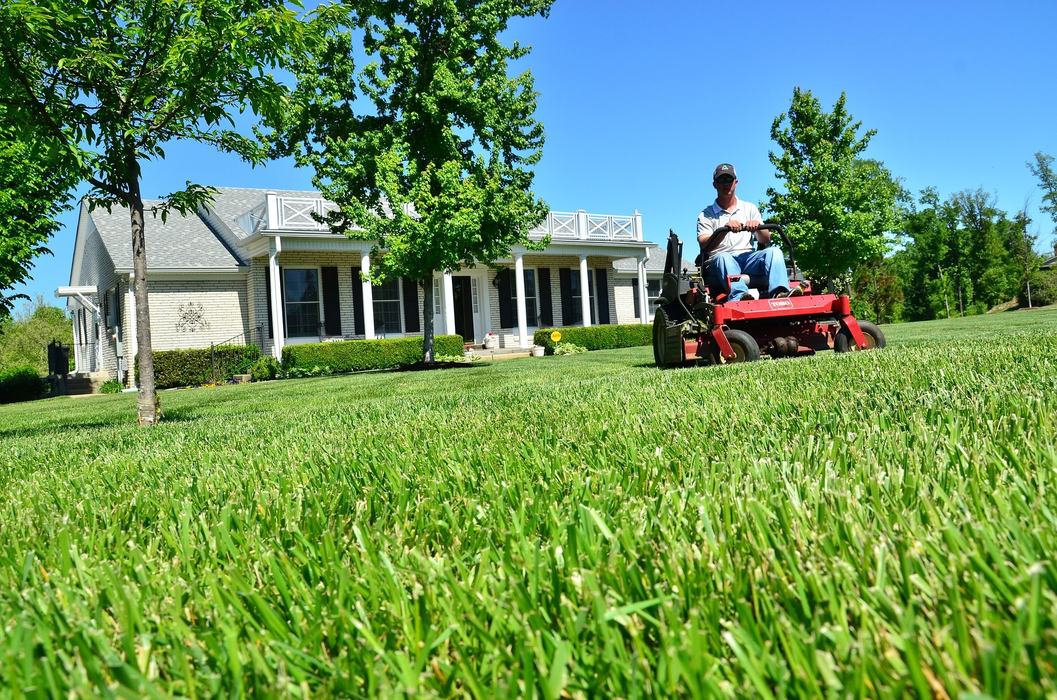 Man mowing grass on riding mower