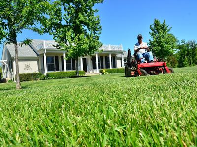 Man mowing grass on riding mower