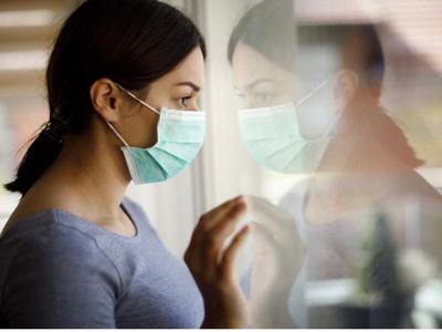 Teen With Mask Looking Through Glass