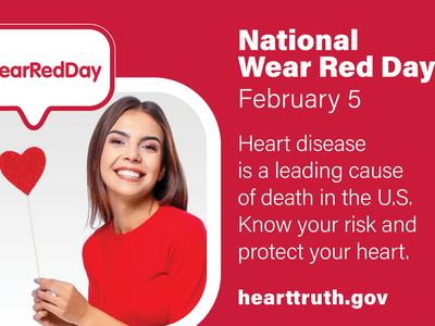 Woman in red holding heart prop; text: "National Wear Red Day February 5" and "#WearRedDay"