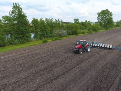 Tractor tilling a field