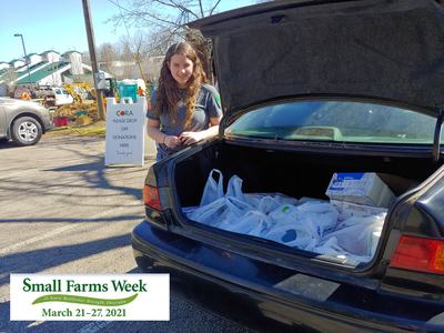 Person by car trunk with donation bags; sign: "PLEASE DROP OFF DONATIONS HERE"; Small Farms Week Mar 21–27