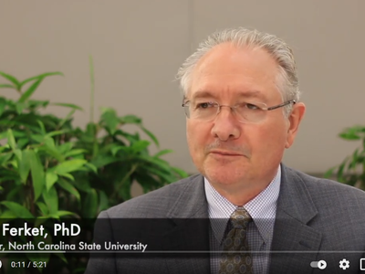 Still frame of Peter Ferket, including his name and title